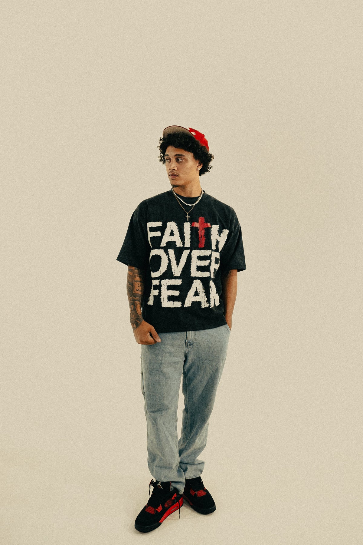 Model wearing Faith Over Fear tee