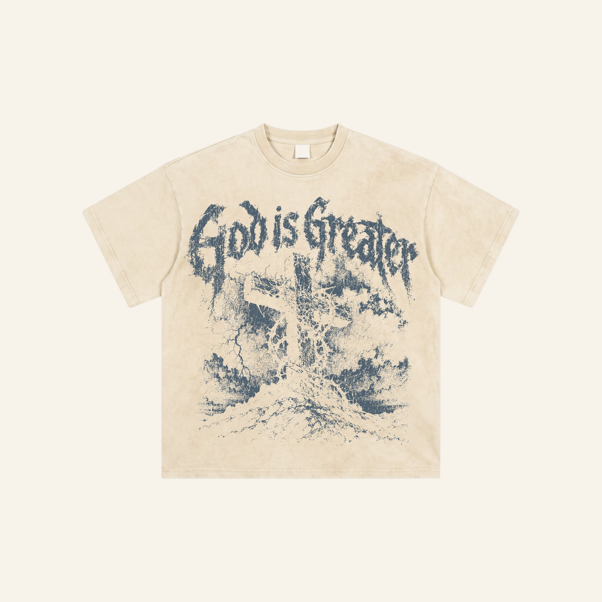 God Is Greater Tee cream flat lay on cream background